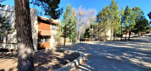 an empty street in front of a building at High Sierra Condominiums in Ruidoso