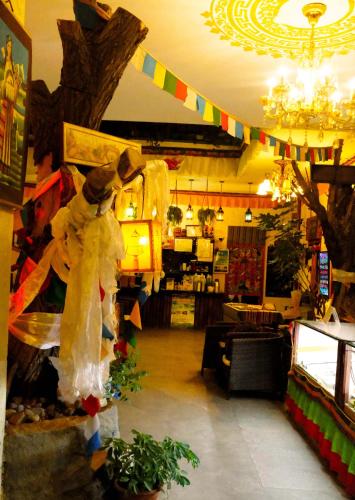 a store with a christmas decorations in a room at Gaisang Mêdog Aroma Fragrance Hotel in Lhasa