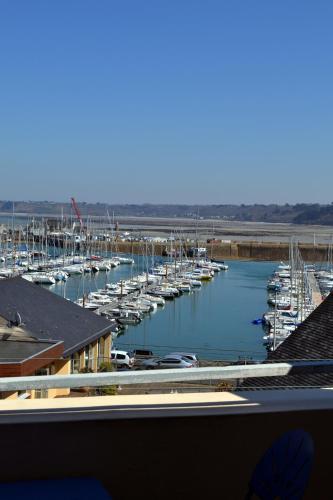 a group of boats docked in a marina at Au Bon Accueil in Perros-Guirec