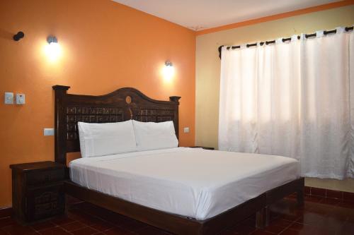 Postel nebo postele na pokoji v ubytování Hotel Casa Rico