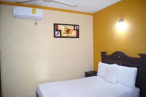 Postel nebo postele na pokoji v ubytování Hotel Casa Rico