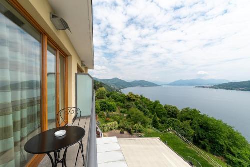 a balcony with a view of a lake at Hotel Ristorante San Carlo in Arona