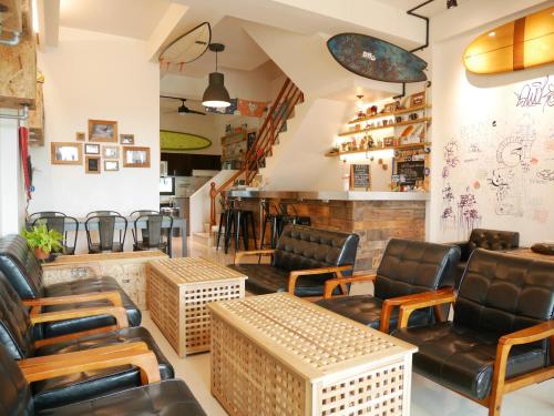 a barber shop with leather chairs and a barbershop at Wave backpackers in Toucheng