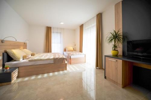 Postel nebo postele na pokoji v ubytování HOTEL BARON