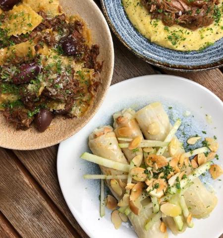 two plates of food on a wooden table at The Plume of Feathers in Sherborne