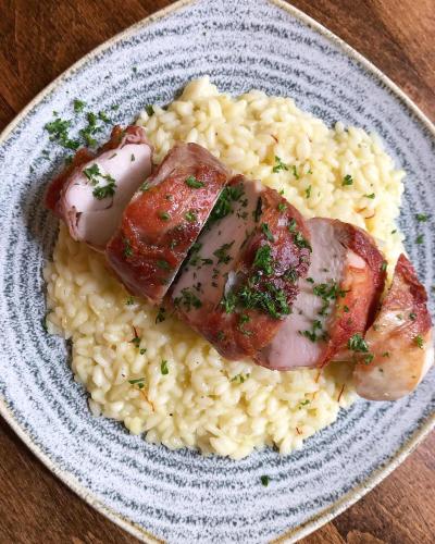 a plate of food with meat and rice on a table at The Plume of Feathers in Sherborne