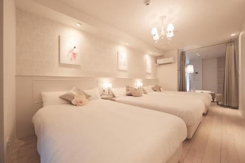 Un pat sau paturi într-o cameră la ReLA Higashimatsudo