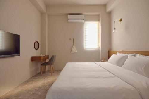 Voodi või voodid majutusasutuse Sunlight Homestay toas