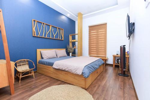Ein Bett oder Betten in einem Zimmer der Unterkunft HomeStay Võ Thị Yến