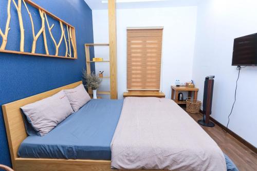 Ein Bett oder Betten in einem Zimmer der Unterkunft HomeStay Võ Thị Yến
