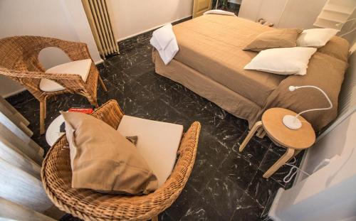 a bedroom with a bed and a table and chairs at Rotaret in Valencia
