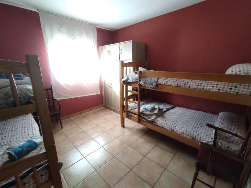 A bed or beds in a room at Casa Rural El Olmo