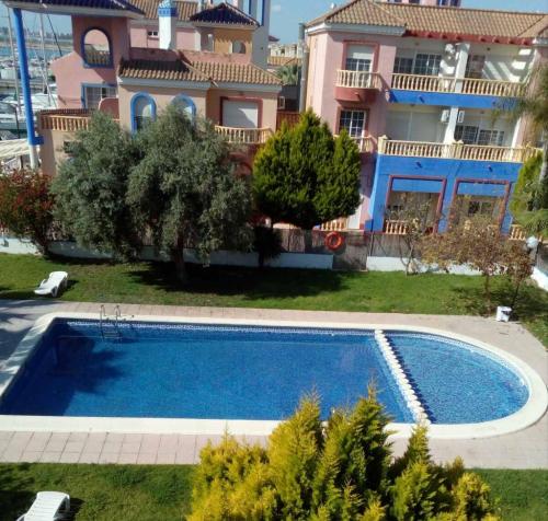 The swimming pool at or close to Apartamento Marina Port sea view