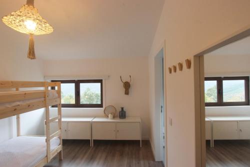 Ένα ή περισσότερα κρεβάτια σε δωμάτιο στο Hostel Retiro do Gerês