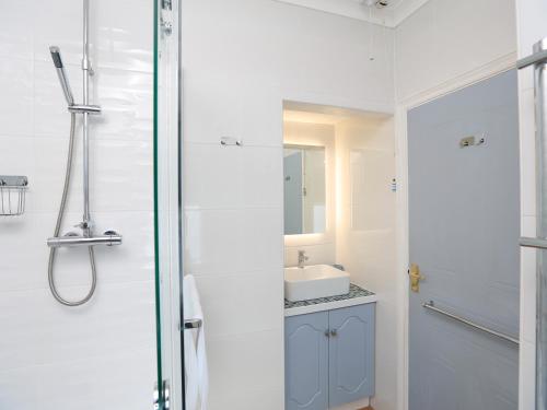 a bathroom with a shower and a sink at 4 The Elms in Salcombe