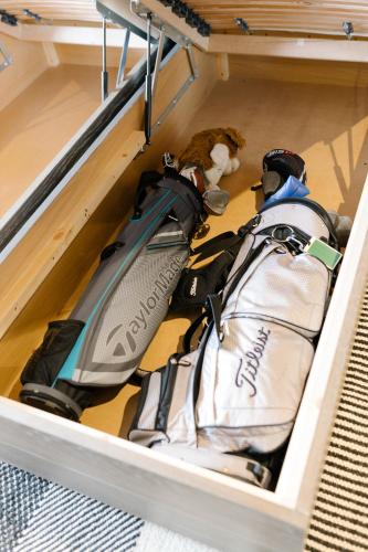 a drawer with a bag and a teddy bear at No1 Apartments & Bedrooms St Andrews - St Mary's in St. Andrews