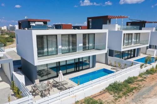 an aerial view of a house with a swimming pool at Diamond villas in Protaras