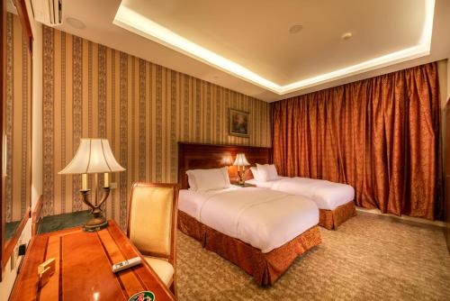 Кровать или кровати в номере الخالدية سويت للأجنحة الفندقية
