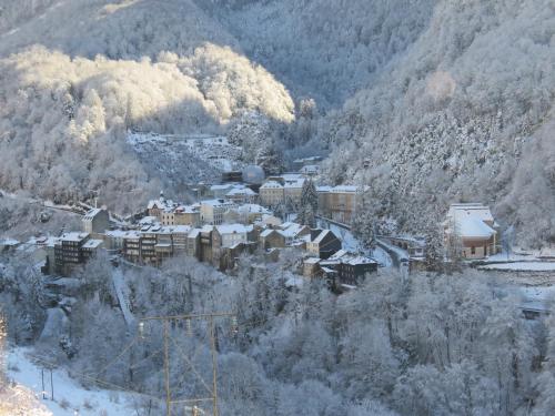 a small town covered in snow in a mountain at Hotel Richelieu in Eaux-Bonnes