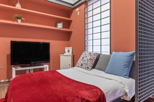 Giường trong phòng chung tại Contemporary flat with 1-Bedroom in Madrid