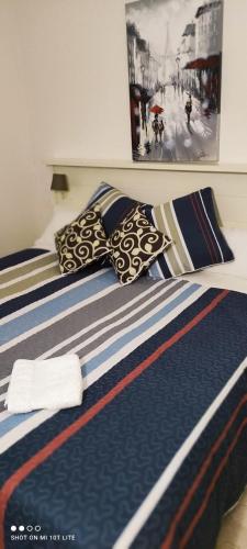 a couple of beds with pillows on top of them at Ground floor with view by Bev in San Javier