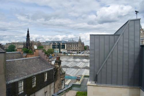 a view of the city from the roof of a building at Modern and Charming 2 Bedroom Old Town Apartment in Edinburgh