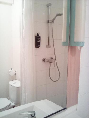 a bathroom with a shower with a sink and a toilet at ibis Saint Quentin Basilique in Saint-Quentin