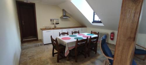 a dining room with a table and some chairs at La Diligence in Arsdorf