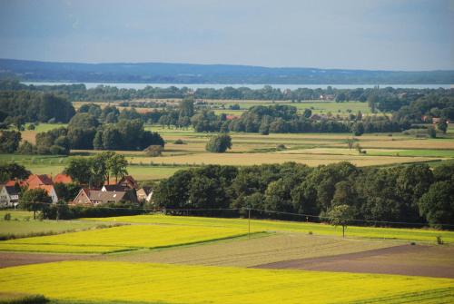 a view of a field with a tennis court at Gästehof Brockum, altes Bauernhaus, großer Garten in Brockum