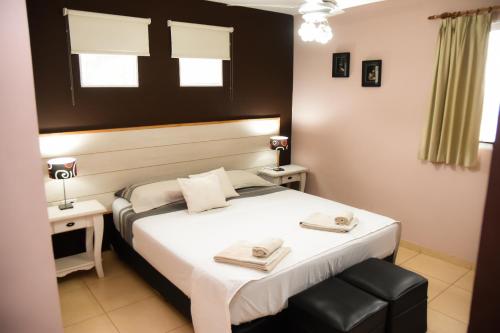 Säng eller sängar i ett rum på Casa Calma Hotel