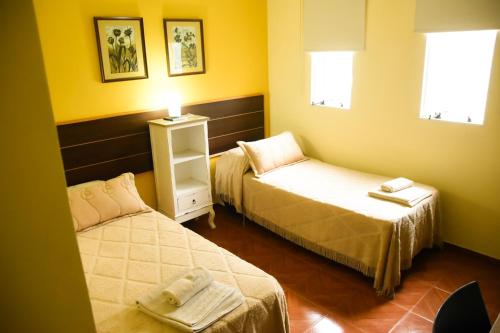 Postel nebo postele na pokoji v ubytování Casa Calma Hotel