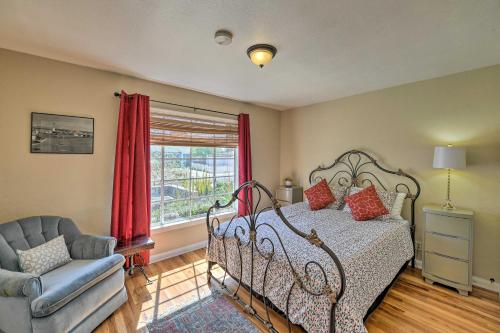 a bedroom with a bed and a chair and a window at Vintage Downtown Vegas Retreat Less Than 3 Mi to Strip! in Las Vegas