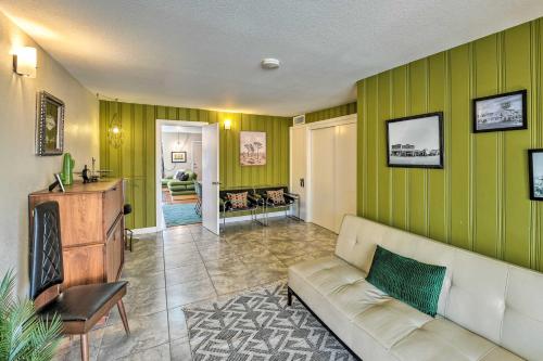 a living room with green walls and a couch at Vintage Downtown Vegas Retreat Less Than 3 Mi to Strip! in Las Vegas