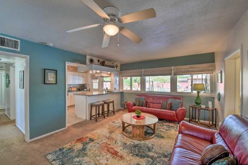a living room with a couch and a ceiling fan at Vintage Las Vegas Oasis Less Than 3 Mi to the Strip! in Las Vegas