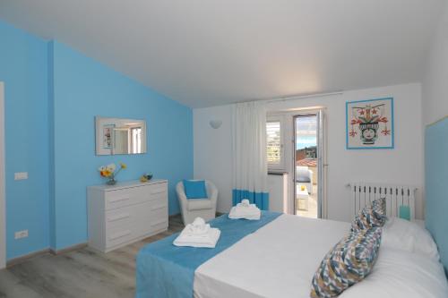Katil atau katil-katil dalam bilik di Relais Villa Chiara free parking