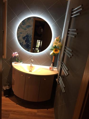 a bathroom with a sink and a mirror at Ferienhaus 33 Altmühlthal in Kinding