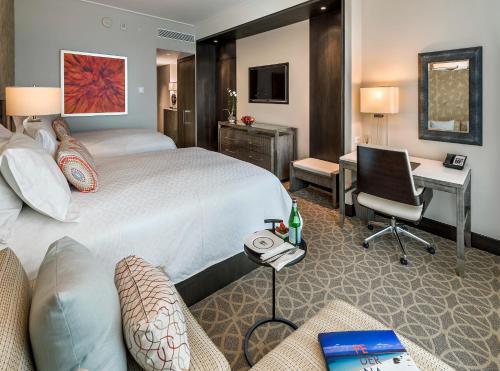 a hotel room with a bed and a desk at InterContinental Real Santo Domingo by IHG in Santo Domingo
