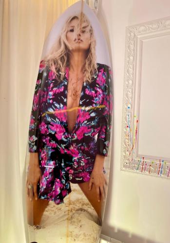 une femme en robe fleurie dans un miroir dans l'établissement BEAUTIFUL PLACE WITH BREATHTAKING PRIVATE ROOFTOP TERRACE 210m2 IN CITY OF LOVE PARIS, à Paris