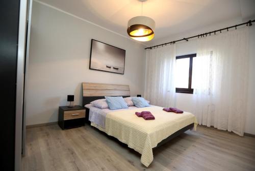 Postel nebo postele na pokoji v ubytování Apartment Sea relief