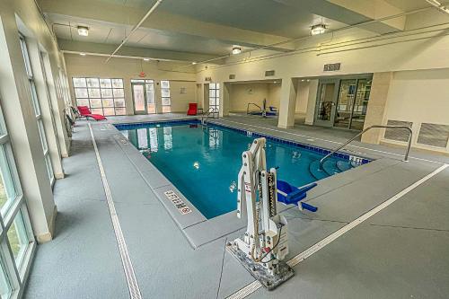 a large swimming pool in a large building at Wingate by Wyndham Panama City Area Lynn Haven in Panama City