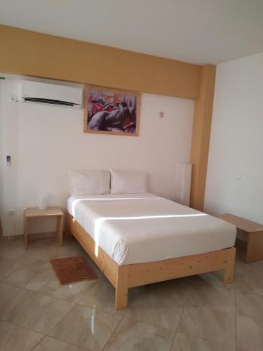En eller flere senge i et værelse på IMOBITUR Apartamentos - Palmarejo Baixo
