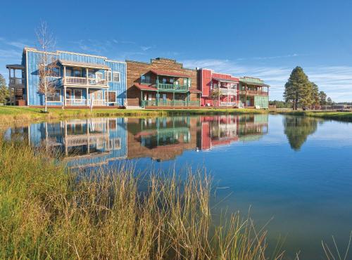 a building next to a body of water at WorldMark Bison Ranch in Overgaard