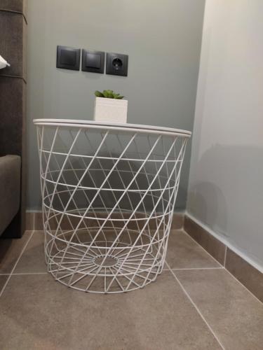 a table with a plant on top of it at Stefani apartments in Methana