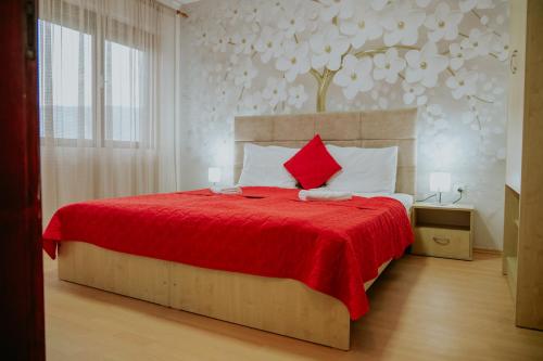 سرير أو أسرّة في غرفة في Vila Dinka