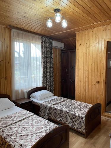 Cama o camas de una habitación en Гостевой дом Эмили