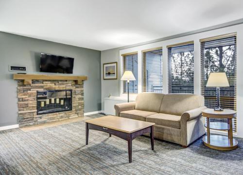a living room with a couch and a fireplace at Seventh Mountain Resort in Bend