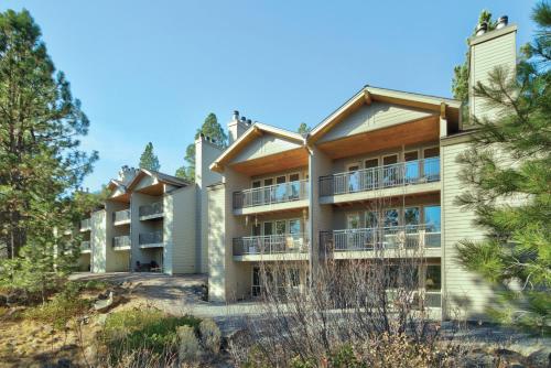 an exterior view of a building with trees at Seventh Mountain Resort in Bend