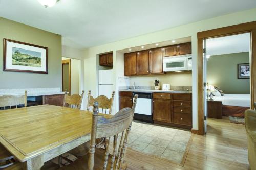 a kitchen and living room with a wooden table and a dining room at Seventh Mountain Resort in Bend