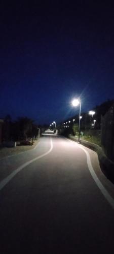 an empty street at night with a street light at Hotel Ristorante Miramare in Pesaro