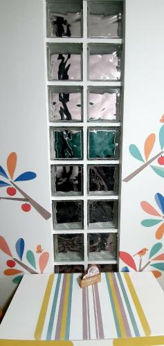 a shelf filled with lots of water in a room at Nordapartament in Suceava
